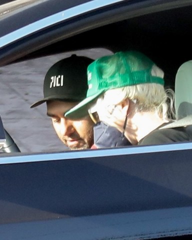 Malibu, CA  - *EXCLUSIVE*  - Lady Gaga and boyfriend Michael Polansky pick up his car that was parked on PCH in Malibu. The pop star wore a green cap over her hair which appeared to have been chopped down just beneath her ear  with a strand of hair left long to her shoulders.  Pictured: Lady Gaga, Michael Polansky  BACKGRID USA 10 MAY 2022   BYLINE MUST READ: RMBI / BACKGRID  USA: +1 310 798 9111 / usasales@backgrid.com  UK: +44 208 344 2007 / uksales@backgrid.com  *UK Clients - Pictures Containing Children Please Pixelate Face Prior To Publication*