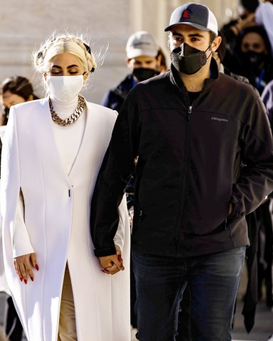 Singer and actress Lady Gaga leaves the US Capitol building with her boyfriend Michael Polansky following an inauguration ceremony rehearsal in Washington, DC, USA, 19 January 2021. Jennifer Lopez and Lady Gaga will be performing at the inauguration ceremony of Joe Biden as the 46th President of the United States on 20 January. US Capitol Inauguration Preparation, Washington, USA - 19 Jan 2021 Wearing Givenchy, Custom