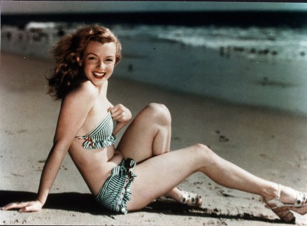 Required for editors only Credits: Photo: Snap / Shutterstock (390853hn) Stills from 1947 movies, swimwear, beaches, clothing, Marilyn Monroe, Oceans, pinups, bikinis, swimwear, sexy, swimwear, sand, reclining, smiles, SHOES, FAT, MIDRIFF IN 1947 VARIOUS