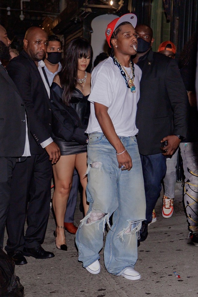 Rihanna and ASAP Rocky are swarmed by security as they leave the Canary Club in NYC
