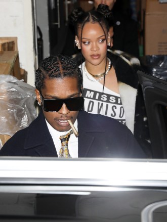 Bevelry Hills, CA - *EXCLUSIVE* - Rihanna & A$AP Rocky enjoyed a date night in Beverly Hills a few days after showing off their baby boy to the world.  A$AP Rocky shows up with a hand full of cogniac brands “Mercer + Prince”.  The rapper has joined many others in the spirits game, making his name on the affordable $38 a bottle Canadian blended Whiskey.  The pair kept the look casual with both sporty jeans with the Fenty mogul pairing her jeans with loose jackets and a T-shirt that read Missing Parents Tips.  Rocky teamed jeans with a blazer, white shirt, tie, and belt with a dollar sign buckle.  Photo: Rihanna, ASAP Rocky BACKGRID US December 20, 2022 US: +1 310 798 9111 / usasales@backgrid.com UK: +44 208 344 2007 / uksales@backgrid.com *UK customers - Images with children Please mark pixels before publishing *