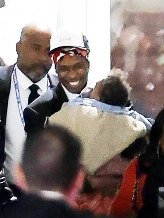 Glendale, AZ - *EXCLUSIVE* - ASAP Rocky holds his baby and laughs with Jay Z as he leaves the Super Bowl in Glendale, AZ.  He must have been in high spirits after his girlfriend Rihanna announced that the two were expecting their second child in her stunning first-half performance.  Photo: ASAP Rocky, Jay Z BACKGRID USA FEBRUARY 12, 2023 BY LINE MUST READ: ShotbyJuliann / BACKGRID USA: +1 310 798 9111 / usasales@backgrid.com United Kingdom: +44 208 344 2007 / uksales@backgrid .com *UK Customers - Image Contains Children Please pixelate face before publishing*