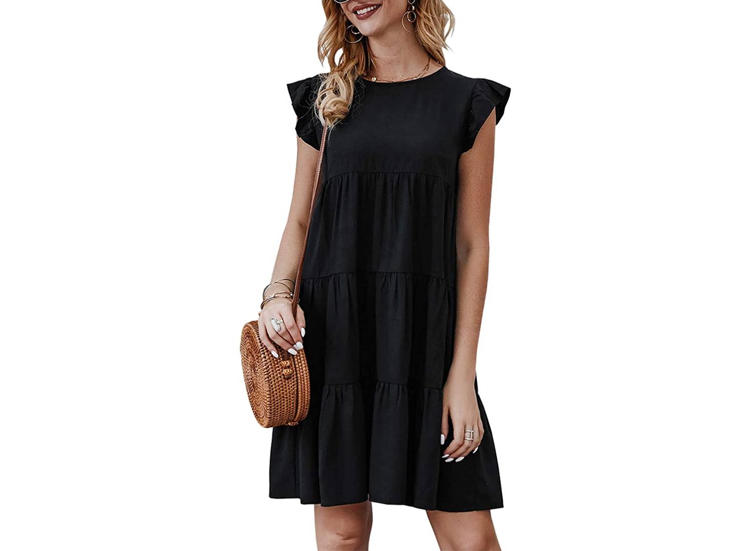 Woman wearing black sleeveless tiered sundress and brown purse