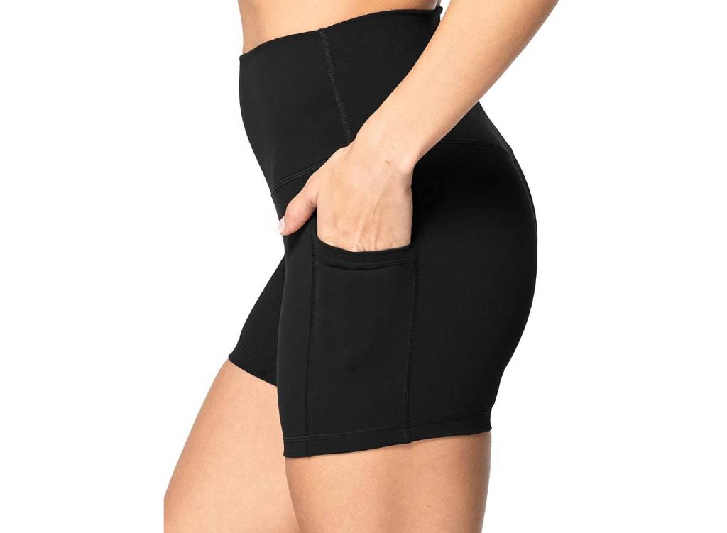 Woman wearing black Sunzel biker shorts with side pockets