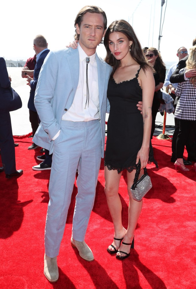 Lewis Pullman & Rainey Qualley pose together