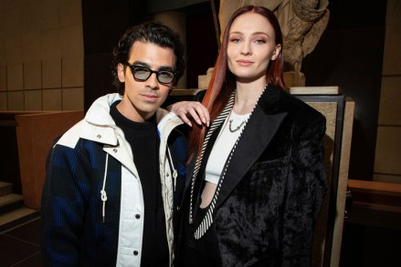 Joe Jonas, left, and Sophie Turner attend the Louis Vuitton Ready To Wear Fall/Winter 2022-2023 fashion collection, which was unveiled during Fashion Week in Paris Fashion Vuitton F/W 22-23 Front Row, Paris, France - March 7, 2022
