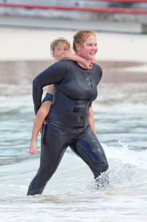 Amy Schumer with her husband Chris Fischer and son Gene David Fischer enjoy a fun day on the beach in Saint Barts, French West Indies on December 27, 2022. Photo by ABCAPRESS.COM**US PICTURE OF CHILDREN PIXELATED ALLOWED IF YOUR TERRITORY REQUIRES **Photo : Amy Schumer Reference: SPL5511875 271222 NON-EXCLUSIVE Image by: AbacaPress / SplashNews.com Featured News and ImagesUSA: +1 310-525-5808London: +44 (0)20 8126 1009Berlin: +49 175 3764 166photodesk@splashnews.com United Arab Emirates rights, Australian rights, Bahrain rights, Canada rights, Greek rights, India rights, Israel rights, Korean rights Nations, New Zealand Rights, Qatar Rights, Saudi Arabia Rights, Singapore Rights, Thailand Rights, Taiwan Rights, United Kingdom Rights, United States of America Rights