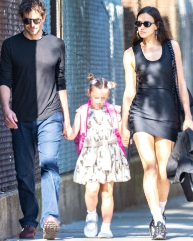 New York, NY  - *EXCLUSIVE*  - Irina Shayk spotted for the first time amid reports Jeffrey Epstein had scheduled to meet her in 2012. The top model was seen stepping out with Bradley Cooper and their daughter this morning. The Russian model  stepped out in a black tank dress, sneakers, sunnies and large hoops as she held hands with her daughter with a scruffy Cooper on the other side.Pictured: Irina Shayk, Bradley CooperBACKGRID USA 1 JUNE 2023 USA: +1 310 798 9111 / usasales@backgrid.comUK: +44 208 344 2007 / uksales@backgrid.com*UK Clients - Pictures Containing ChildrenPlease Pixelate Face Prior To Publication*
