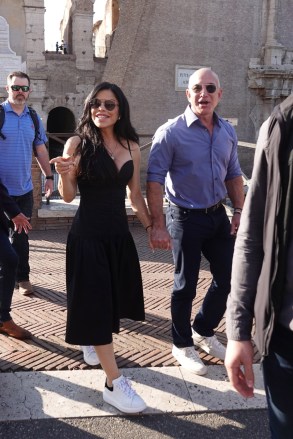 Rome, ITALY - Billionaire Jeff Bezos and Lauren Sanchez walk hand in hand after visiting the Colosseum in Rome.  The happy couple later dined at The Court restaurant in front of the Colosseum.  Photo: Jeff Bezos, Lauren Sanchez BACKGRID USA 15 OCTOBER 2022 WHERE TO READ: Cobra Group / BACKGRID USA: +1 310 798 9111 / usasales@backgrid.com UK: +44 208 344 2007 *backgridcomsale.  Images With Children Please Pixelate Face Before Downloading*