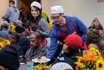 US actors Daniel Kountz (R), and Kimberly Brown (2-L), serve Thanksgiving meal at the Los Angeles Mission, in Los Angeles, California, USA, 27 November 2019. Thousands of Skid Row residents and homeless people from downtown and beyond were served Thanksgiving dinners during the Los Angeles Mission's annual holiday feast.
Homeless receive Thanksgiving meal, Los Angeles, USA - 27 Nov 2019