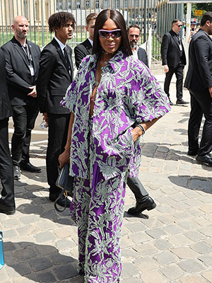 Naomi Campbell Cools Down In Undone Tropical Top for Louis Vuitton