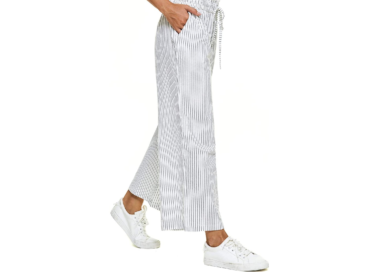 A model wearing striped linen pants.