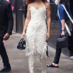 Tessa Thompson is seen in a white fringe Armani dress with black Armani bag outside ABC Studios in New York City