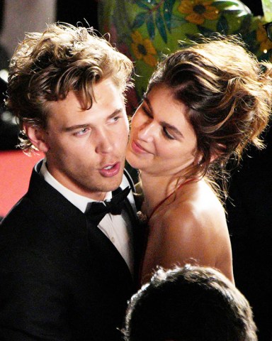 Austin Butler, left, and Kaia Gerber pose for photographers after departing the premiere of the film 'Elvis' at the 75th international film festival, Cannes, southern France
2022 Elvis Departures, Cannes, France - 25 May 2022