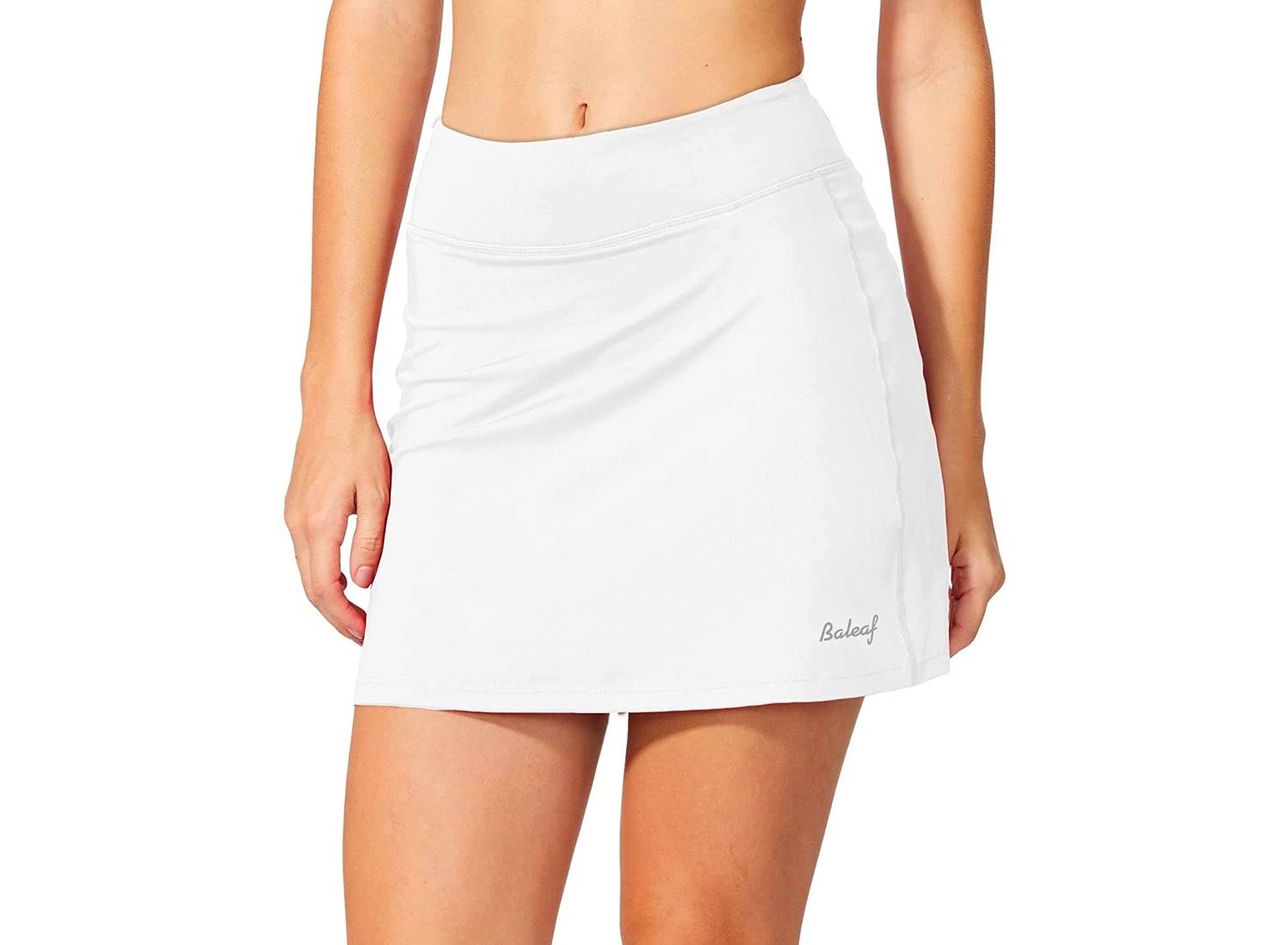 Woman wearing white tennis skirt