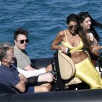 Multi-Billionaire Elon Musk spends his vacay on a yacht with friends and a beautiful brunette in Mykonos!