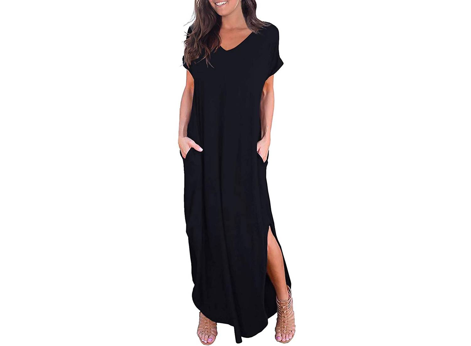 Woman wearing a black loose-fitting short sleeve maxi dress with sandals