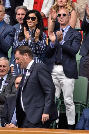Amazon CEO and Chairman Jeff Bezos and Lauren Sanchez arrive to watch the Men's Singles Finals on Center Court Tennis on Day 13 of the 2019 Wimbledon Tennis Championships held at The All England Lawn Tennis and Croquet Club Wimbledon Tennis Championships, Day 13, The All England Lawn Tennis and Croquet Club, London, UK - 14th July 2019