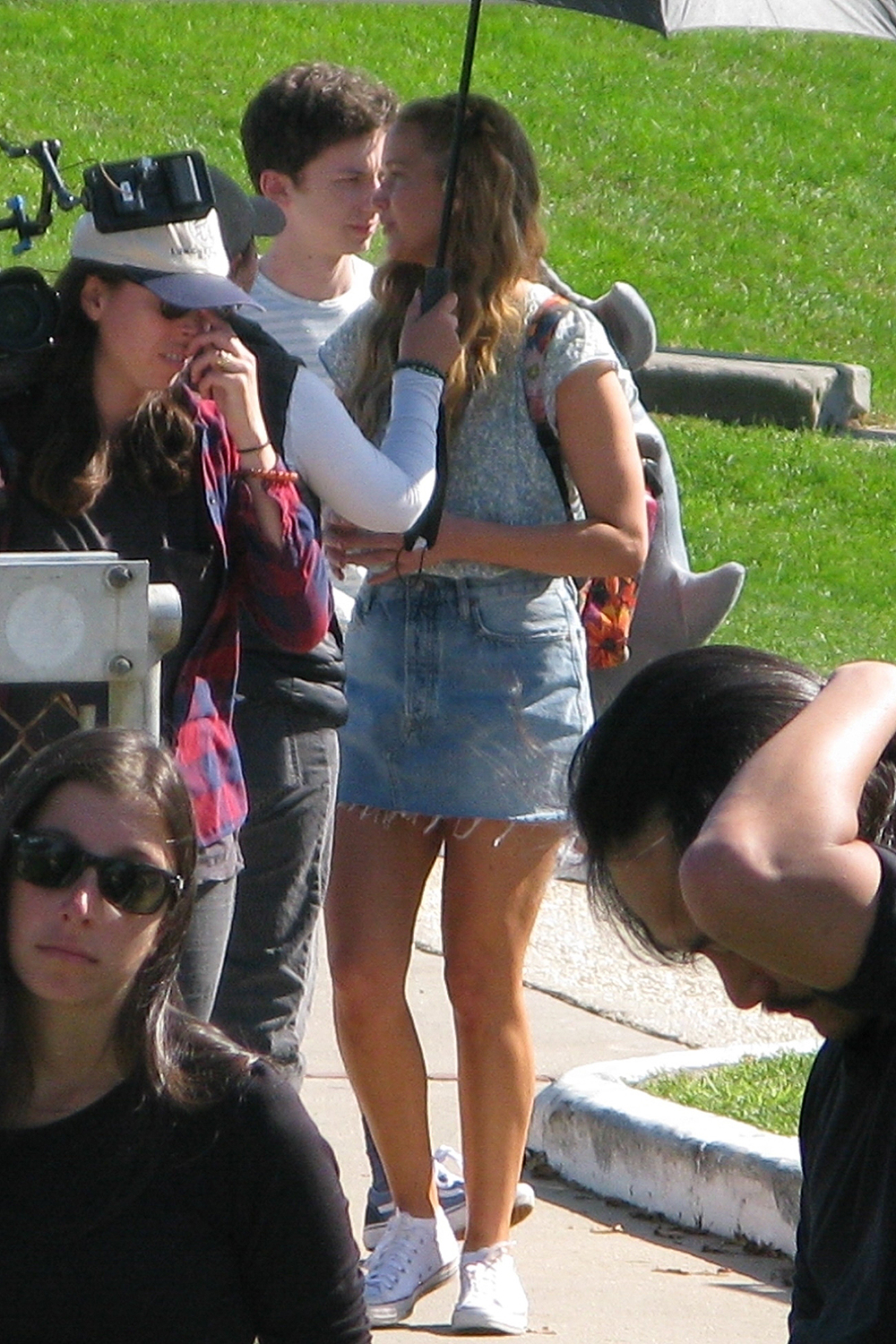 Jennifer Lawrence sports a shark plush backback as she gets to work on No Hard Feelings filming at the Montauk Lighthouse.