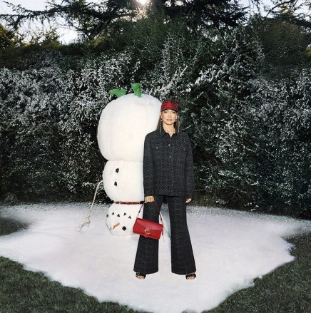 Coach introduces "Feel the Wonder," a holiday campaign featuring Jennifer Lopez, Zoey Deutch and Chan-young Yoon. A playful celebration of the kid in all of us, the campaign, shot and directed by Anton Gottlob, captures the season's joyful, child-like sense of wonder while spotlighting the house's Winter 2022 collection. Tapping into the next generation's love for playfully remixing nostalgic references through creative self-expression, "Feel the Wonder" captures the Coach Family in larger-than-life scenes that feature the holiday season's spirit of warmth, joy and embracing your inner child. Featuring scenes where the cast plays in the snow, jumps on the bed and unwraps presents, the campaign showcases the house's new Heart bag and Tabby and Studio bags, along with Winter's 2022 ready-to-wear inspired by Stuart Vevers' vision of timeless American heritage juxtaposed with the attitude of counter-culture. To celebrate the holiday season, Coach also unveiled its first virtual shopping destination. Inspired by a vintage Coach store, the immersive experience allows guests to move throughout themed rooms, shop the holiday collection and play a game with Rexy, the house's mascot, to unlock special prizes. Additionally, visitors will have the opportunity to shop via livestream videos alongside friends and influencers. The virtual store, which is powered by experiential e-commerce platform Obsess, will feature iconic Coach styles including the Tabby and Rogue, along with a dedicated section for holiday party bags and new giftable items, and a special collection featuring Rexy. 02 Nov 2022 Pictured: Jennifer Lopez, Zoey Deutch, and Chan-Young Yoon. Photo credit: Coach/MEGA TheMegaAgency.com +1 888 505 6342 (Mega Agency TagID: MEGA913952_003.jpg) [Photo via Mega Agency]