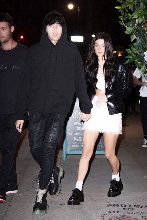 Landon Barker holds hands with rumored new girlfriend, TikTok star Charli D'Amelio as they leave Machine Dun Kelly's Madison Square Garden afterparty at Catch Steakhouse in New York.  The rumored couple were joined by Charli's older sister and fellow TikTok star Dixie.  Landon's father, Travis Barker was rushed to hospital in LA for an unknown illness.  Pictured: Landon Barker, Charli D'Amelio Ref: SPL5322685 290622 NON-EXCLUSIVE Picture by: WavyPeter / SplashNews.com Splash News and Pictures USA: +1 310-525-5808 London: +44 (0) 20 8126 1009 Berlin: + 49 175 3764 166 photodesk@splashnews.com World Rights