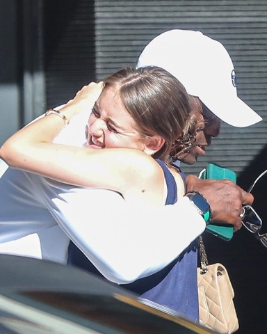 Beverly Hills, CA  - *EXCLUSIVE*  - Seal and daughter Leni Klum share a warm embrace after having Tuesday dinner at the Honor Bar restaurant in Beverly Hills.Pictured: Seal, Leni Klum BACKGRID USA 19 JULY 2022 BYLINE MUST READ: SPOT / BACKGRIDUSA: +1 310 798 9111 / usasales@backgrid.comUK: +44 208 344 2007 / uksales@backgrid.com*UK Clients - Pictures Containing ChildrenPlease Pixelate Face Prior To Publication*