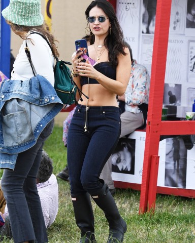 Glastonbury, UNITED KINGDOM  - British Actress Lily James shows off her fashion sense spotted at the Glastonbury Festival.  Pictured: Lily James  BACKGRID USA 24 JUNE 2022   USA: +1 310 798 9111 / usasales@backgrid.com  UK: +44 208 344 2007 / uksales@backgrid.com  *UK Clients - Pictures Containing Children Please Pixelate Face Prior To Publication*