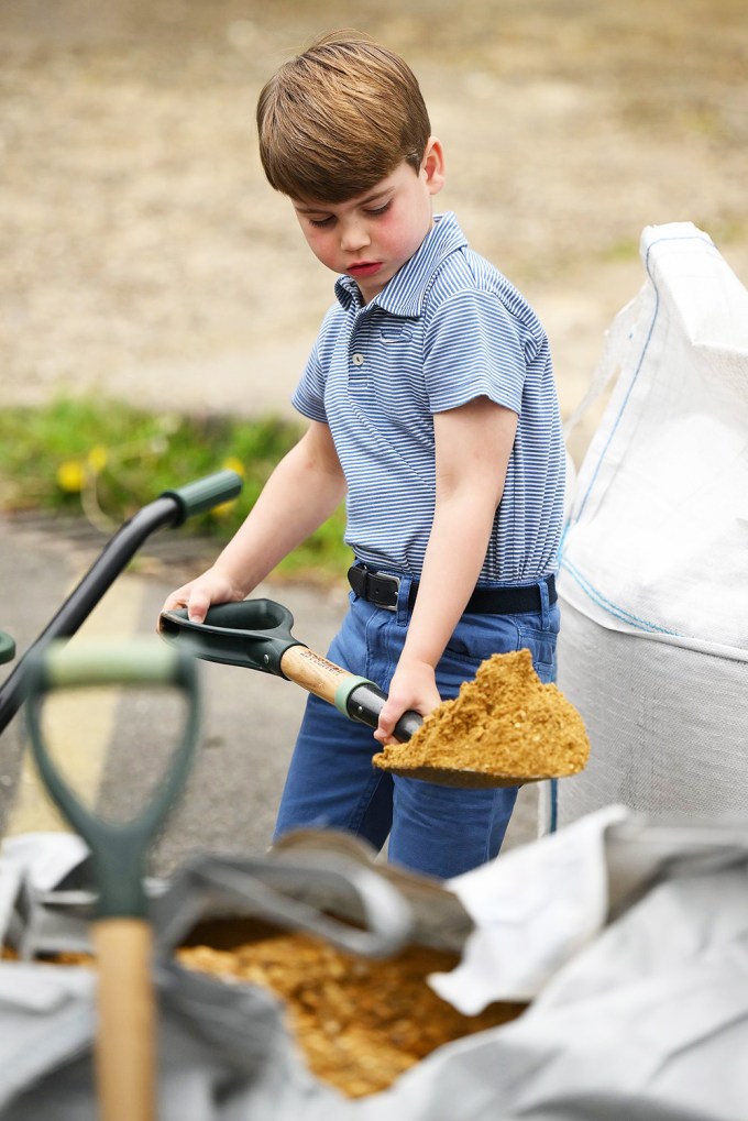 Prince Louis shovels dirt