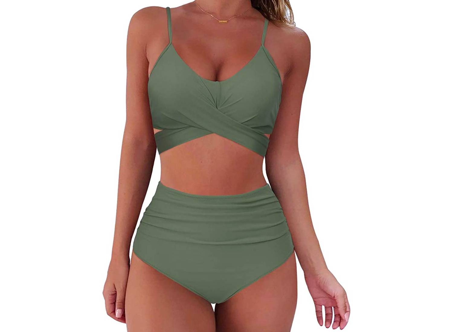 A woman wearing a green high-waisted bikini set