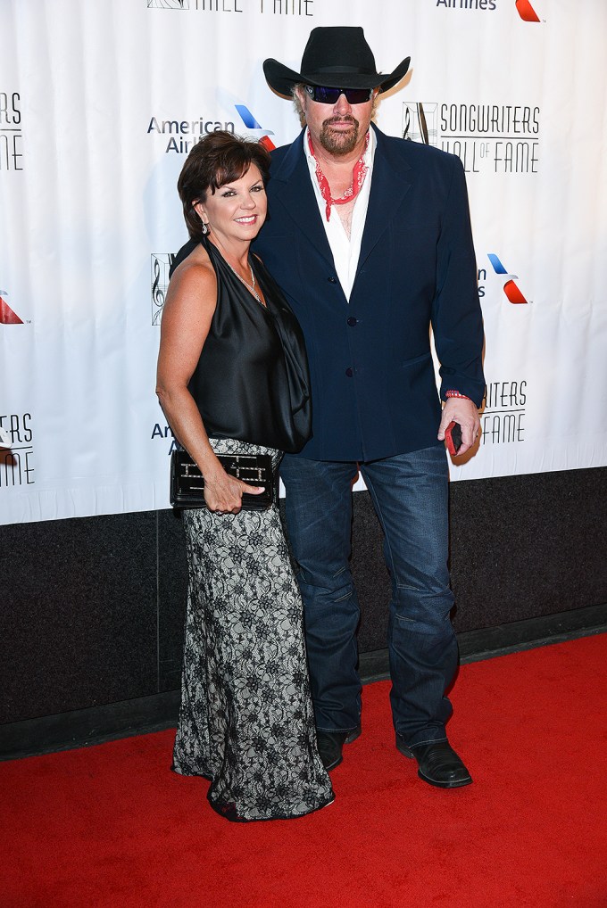 Toby Keith & Tricia Lucus on a red carpet