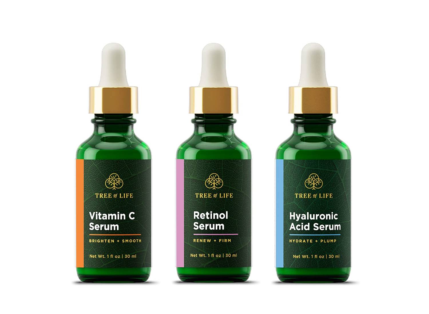 Three green bottles of Tree of Life's serums including: Vitamin C, Hyaluronic Acid and Retinol
