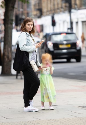 EXCLUSIVE: Kate Mara who announced yesterday (10th July 2022) that she is expecting another baby with Jamie Bell seen in London with their first child on the 5th July. Kate and her daughter Mara were seen heading into a sweet shop. 05 Jul 2022 Pictured: Kate Mara. Photo credit: MEGA TheMegaAgency.com +1 888 505 6342 (Mega Agency TagID: MEGA876874_001.jpg) [Photo via Mega Agency]