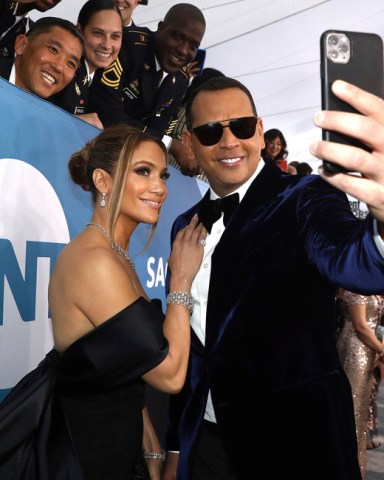 Jennifer Lopez, left, and Alex Rodriguez take a selfie as they arrive at the 26th annual Screen Actors Guild Awards at the Shrine Auditorium & Expo Hall in Los Angeles. Lopez and Rodriguez said, in a statement that reports of their split are inaccurate, and they are working things through. A day earlier, multiple reports based on anonymous sources said the couple had called off their two-year engagement
People Jennifer Lopez Alex Rodriguez, Los Angeles, United States - 19 Jan 2020