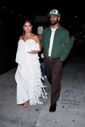West Hollywood, California - *EXCLUSIVE* - Dad-to-be and rapper, Big Sean is the perfect gentleman as he is seen escorting his very pregnant girlfriend Jhene Aiko from The Nice Guy.  Jhene exudes the pregnancy glow as she makes a fashionable exit in a white maxi dress and gold heels.  Pictured: Big Sean, Jhene Aiko BACKGRID USA JULY 24, 2022 BYLINE MUST READ: NGRE / BACKGRID USA: +1 310 798 9111 / usasales@backgrid.com UK: +44 208 344 2007 / UK Clients@backgrid.com Pictures@ backgrid.com Children please include pixelated face before publication*