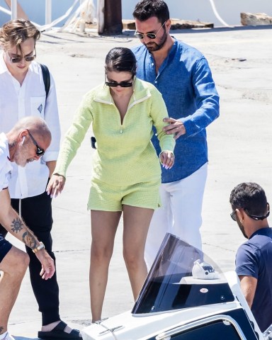 Positano, ITALY  - *EXCLUSIVE*  - The American singer Selena Gomez goes green spotted on her summer holidays accompanied by the Italian–Canadian film producer Andrea Iervolino.The pair made their way to an awaiting boat as Selena was spotted armed with bags in hand ever the gentleman Andrea helped Selena onto the boat.Pictured: Selena Gomez - Andrea IervolinoBACKGRID USA 7 AUGUST 2022 BYLINE MUST READ: Cobra Team / BACKGRIDUSA: +1 310 798 9111 / usasales@backgrid.comUK: +44 208 344 2007 / uksales@backgrid.com*UK Clients - Pictures Containing ChildrenPlease Pixelate Face Prior To Publication*