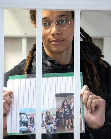 Star and two-time Olympic gold medalist Brittney Griner holds images standing in a cage at a court room prior to a hearing, in Khimki just outside Moscow, Russia, . American basketball star Brittney Griner has returned to a Russian courtroom for her drawn-out trial on drug charges that could bring her 10 years in prison if convicted Russia Griner, Moscow, Russian Federation - 26 Jul 2022