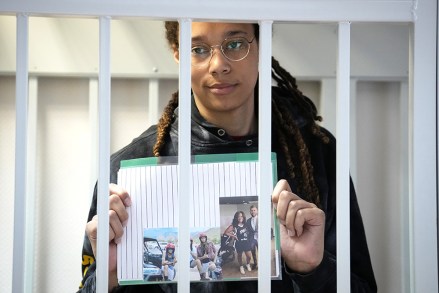 Star and two-time Olympic gold medalist Brittney Griner holds images standing in a cage at a court room prior to a hearing, in Khimki just outside Moscow, Russia.  American basketball star Brittney Griner has returned to a Russian courtroom for her drawn-out trial on drug charges that could bring her 10 years in prison if convicted Russia Griner, Moscow, Russian Federation - 26 Jul 2022