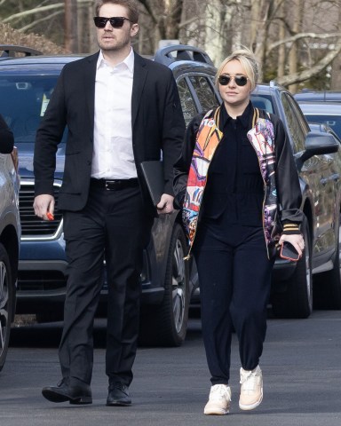 Hayden Panettiere arrives at her younger brother Jansen's celebration of life event in their hometown of Palisades, New York, with her on/off boyfriend Brian Hickerson. The grieving actress wore a colorful bomber jacket and black pants as she attended the memorial at the scenic Palisades Presbyterian Church alongside her mother Lesley Vogel and father Alan ‘Skip’ Panettiere, on Wednesday morning. Jansen’s girlfriend Cat Michie, who has posted a heartfelt tribute to him on social media, was also seen at the venue. ‘Scream, 6’ star Hayden, 33, was expected to speak at the event, which was being held in remembrance of the 28-year-old former child actor, who died last month due to an enlarged heart. A friend of the former actor told officials he'd checked on Jansen at home after he'd failed to show up for a business meeting. Upon arrival, he was found sitting upright in a chair unresponsive. Jansen's dad, Skip, had spoken to his son on the phone just the night before, and thought he "sounded okay." On Wednesday, friends and family came together at the small church which is just a few miles away from Jansen's apartment in Nyack where he was found dead. 08 Mar 2023 Pictured: Brian Hickerson, Hayden Panettiere. Photo credit: MEGA TheMegaAgency.com +1 888 505 6342 (Mega Agency TagID: MEGA953084_001.jpg) [Photo via Mega Agency]