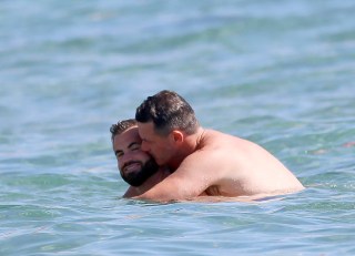 EXCLUSIVE: Luke Evans and his new Spanish boyfriend Fran Tomas PDA kisses and caresses while enjoying a swim on the beaches of Ibiza on August 24, 2022 in Ibiza, Spain. 24 Aug 2022 Pictured: Luke Evans and Fran Tomas. Photo credit: Elkin Cabarcas / MEGA TheMegaAgency.com +1 888 505 6342 (Mega Agency TagID: MEGA888996_002.jpg) [Photo via Mega Agency]