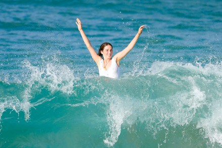 EXCLUSIVE: Stranger Things star Maya Hawke bodysurfing in St Barths. The actress, 24, is the daughter of famous former couple Uma Thurman and Ethan Hawke. 26 Dec 2022 Pictured: Maya Hawke. Photo credit: Spread Pictures / MEGA TheMegaAgency.com +1 888 505 6342 (Mega Agency TagID: MEGA928801_025.jpg) [Photo via Mega Agency]