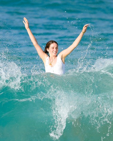 EXCLUSIVE: Stranger Things star Maya Hawke bodysurfing in St Barths. The actress, 24, is the daughter of famous former couple Uma Thurman and Ethan Hawke. 26 Dec 2022 Pictured: Maya Hawke. Photo credit: Spread Pictures / MEGA TheMegaAgency.com +1 888 505 6342 (Mega Agency TagID: MEGA928801_025.jpg) [Photo via Mega Agency]
