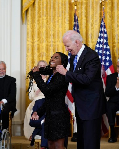 President Joe Biden awards the nation's highest civilian honor, the Presidential Medal of Freedom, to gymnast Simone Biles during a ceremony in the East Room of the White House in Washington, . Biles is the most decorated U.S. gymnast in history, winning 32 Olympic and World Championship medals, and is an advocate on issues including athletes' mental health, children in foster care and sexual assault victims
Biden Medal of Freedom, Washington, United States - 07 Jul 2022