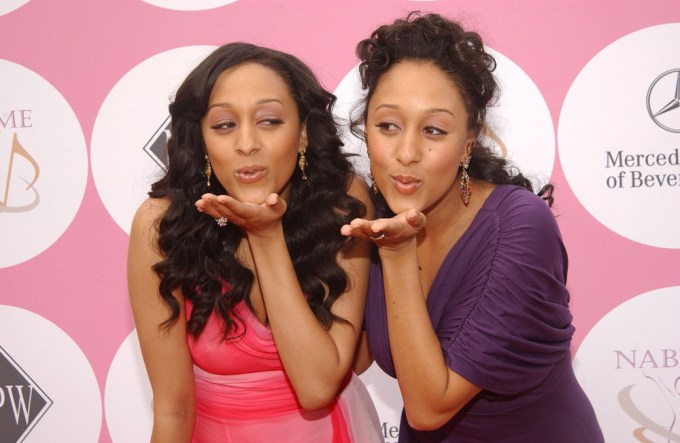 Tia and Tamera Mowry playfully blew kisses while attending a charity