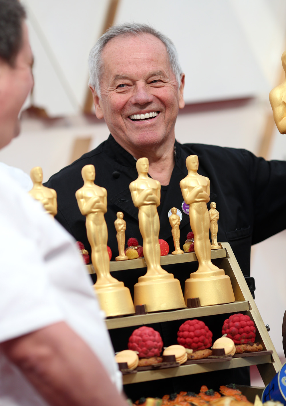 Los Angeles, USA. 25th Mar, 2022. Pâtisserie creations, including one in  the shape of an Oscar trophy, stand on a table. Star chef Wolfgang Puck has  been serving up food for celebrity