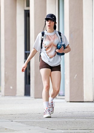 Los Angeles, CA  - *EXCLUSIVE*  - Singer Billie Eilish is out in Los Angeles with a big smile on her face as we catch her leaving the gym one week after her parent's home is doxxed by a crime app. Billie wears a quirky boob print top and brown workout shorts as she walks back to her car with a friend.Pictured: Billie EilishBACKGRID USA 13 JANUARY 2023 USA: +1 310 798 9111 / usasales@backgrid.comUK: +44 208 344 2007 / uksales@backgrid.com*UK Clients - Pictures Containing ChildrenPlease Pixelate Face Prior To Publication*