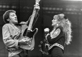 Singer Bruce Springsteen In Concert At Villa Park As Part Of His 1988 Tour Seen Singing With Patti Scialfa 
Singer Bruce Springsteen In Concert At Villa Park As Part Of His 1988 Tour Seen Singing With Patti Scialfa