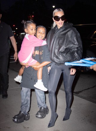 Kim Kardashian returns to her New York City hotel with her two daughters.  Pictured: Kim Kardashian,Chicago West,North West Ref: SPL5326195 140722 NON-EXCLUSIVE Photo By: WavyPeter / SplashNews.com Splash News and Pictures USA: +1 310-525-5808 London: +44 (0)20 8126 1009 Berlin: +49 175 3764 166 photodesk@splashnews.com Worldwide Rights
