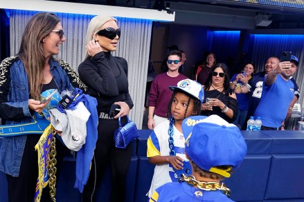 Kim Kardashian, wearing sunglasses, stands near the field after the Los Angeles Rams played an NFL football game against the Dallas Cowboys, in Inglewood, CalifCowboys Rams Football, Inglewood, United States - 09 Oct 2022