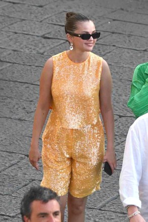 Capri, ITALY - *EXCLUSIVE* - American singer Selena Gomez strolls through town while shopping while on vacation in Capri, Italy.  Sporting her sequined dress, Selena was spotted with friends popping into the Prada designer store as a rather smart looking Italian-Canadian film producer Andrea Iervolino in his suit joined Selena on the shopping spree.  *Taken on August 3, 2022* Pictured: Selena Gomez BACKGRID USA 5 AUGUST 2022 MUST READ: Cobra Team / BACKGRID USA: +1 310 798 9111 / usasales@backgrid.com UK: +44 208 074 208 074 ukgrids.sback com *UK Clients - Pictures Containing Children Please Pixelate Face before Publication*