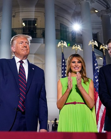 President Donald Trump, first lady Melania Trump and Barron Trump stand on the South Lawn of the White House on the fourth day of the Republican National Convention, in Washington. It's called a "permission structure." President Donald Trump's campaign is trying to construct an emotional and psychological gateway to help disenchanted voters feel comfortable voting for the president again despite their reservations about him personally
Election 2020 Permission Structure, Washington, United States - 27 Aug 2020